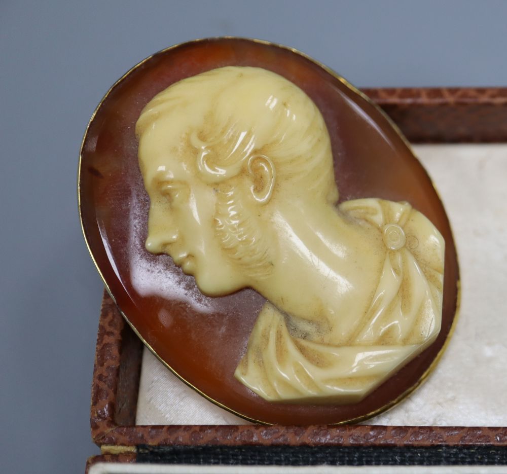 A 19th century composition cameo portrait on a carnelian plaque, in gilt metal mount and three other items,